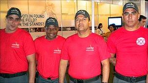 Firemen working as security guards at the Soccerex football finance convention in Rio