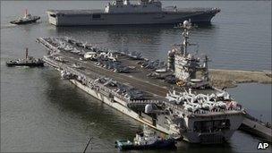 File image (from July 2010) of the USS George Washington, bottom, and the South Korean navy's landing ship Dokdo Ham