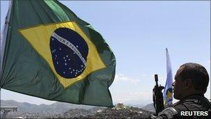 Brazilian flag and police officer