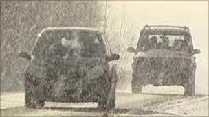 Two cars in snow storm