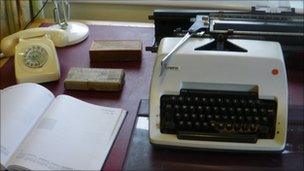 1950s telephone and typewriter