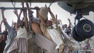 Helicopter delivering food supplies in Punjab province in August 2010