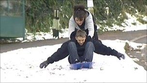 Young people playing in snow