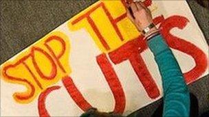 A Plymouth student paints a banner during the occupation