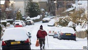 Walker on snowy road