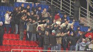 Fans of a local team in the football stadium in Saransk