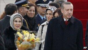 Turkey's Prime Minister Recep Tayyip Erdogan (R) and his wife Emine Erdogan