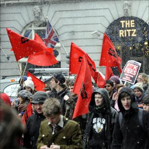 Student protesters pass the Ritz