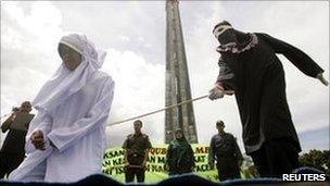 Murni Amris being caned for opening a food stall during the Ramadan fasting month, 1 Oct 2010, Aceh