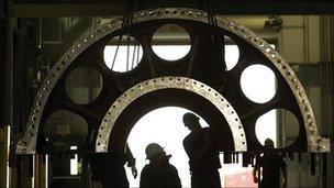 Men inspecting a turbine