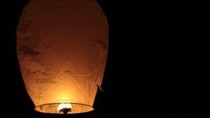 Sky lantern in a night sky