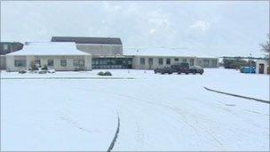 Snow covers wide road junction