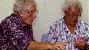 Two pensioners playing cards