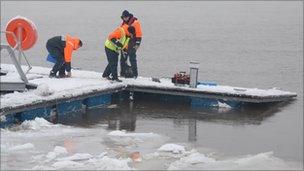 Volunteers at Foyle Search and Rescue trying to save the pontoon from the ice