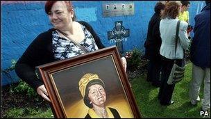 Irene Connolly with a portrait of her mother Joan who was killed by the Army at Ballymurphy in 1971