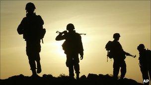 Sri Lankan soldiers walk back to an army camp near Colombo on 9 July 2007