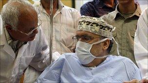 Abdelbaset Ali al-Megrahi with medical mask on