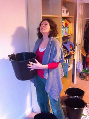 Nina MacLeod catching drips in her bucket