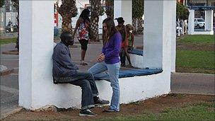 Segal Rosen speaks to a Sudanese man