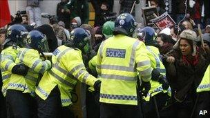 Students and police clash at a protest against tuition fees