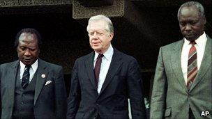 Robert Ouko (left), ex US President Jimmy Carter (c) and President Moi (right)