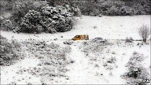 A recovery van attends to a vehicle near Boxhill in Surrey