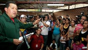 President Hugo Chavez addressing flood victims in Caracas