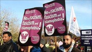 Demonstrators opposing a march by the English Defence League march through the centre of Peterborough, Cambridgeshire, on Saturday 11 December