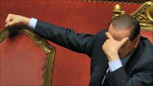 Mr Berlusconi reacts after delivering an address to the Senate on 13 December 2010 in Rome