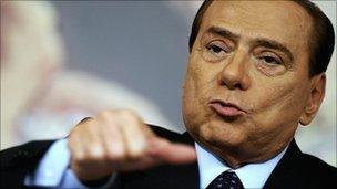 Italian Prime Minister Silvio Berlusconi gestures during a news conference in November 2010