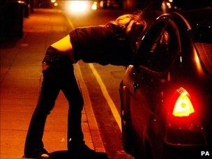 Prostitute talking to driver in UK - file pic