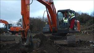 Carol Steere breaks ground for the start of the build of the new Les Beaucamps High School