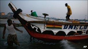 Ghanaian fishermen prepare to head out to sea just after dawn (Archive photo 2008)