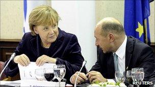 German Chancellor Angela Merkel talks to Romanian President Traian Basescu, 16 Dec 10