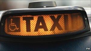 A taxi "for hire" sign