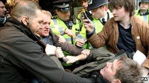 Security guards and police remove UK Uncut demonstrators from Topshop, on London's Oxford Street