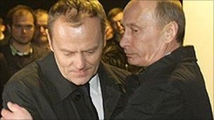 Russian Prime Minister Vladimir Putin (right) hugs his Polish counterpart Donald Tusk at the crash site, photo 10 April