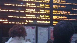 Passengers wait at Kings Cross