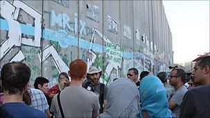 Visit 2 Palestine group by the separation wall