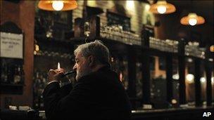 A man smokes in a bar in Pamplona, Spain, 21 December 2010