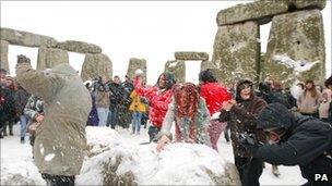 Snowball fight at Stone Henge on the winter solstice