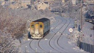 Train making its way through snow near Llandudno Junction, Conwy