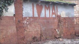 MAL graffiti on wall of house, Devecser