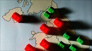 Monopoly pieces on map