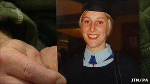 David Yeates holding his daughter's graduation photo