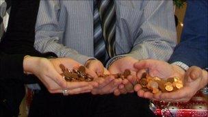 Council workers with pennies