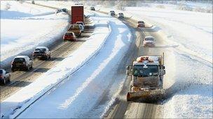 A snow plough makes its way along the A9