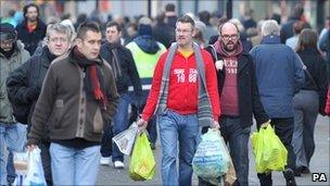 Shoppers in Manchester on Christmas Eve