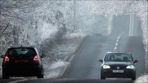 Motorists driving in snowy conditions