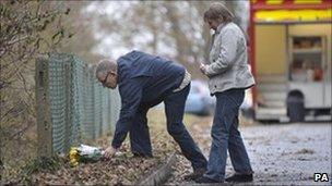 David and Theresa Yeates lay flowers at the scene in Longwood Lane